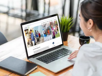 A person reading the Community Strategic Plan Connect Whitby webpage