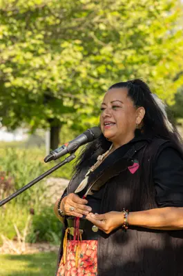 Kim Wheatly speaking in microphone 