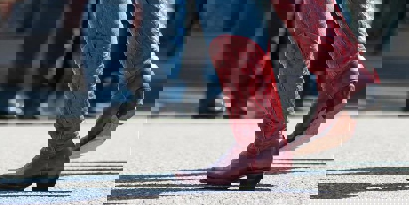 Close up of feet dancing with cowboy boots