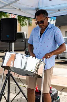 Steel pan drummer playing on street level 