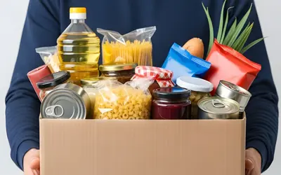 A person holding a box of food
