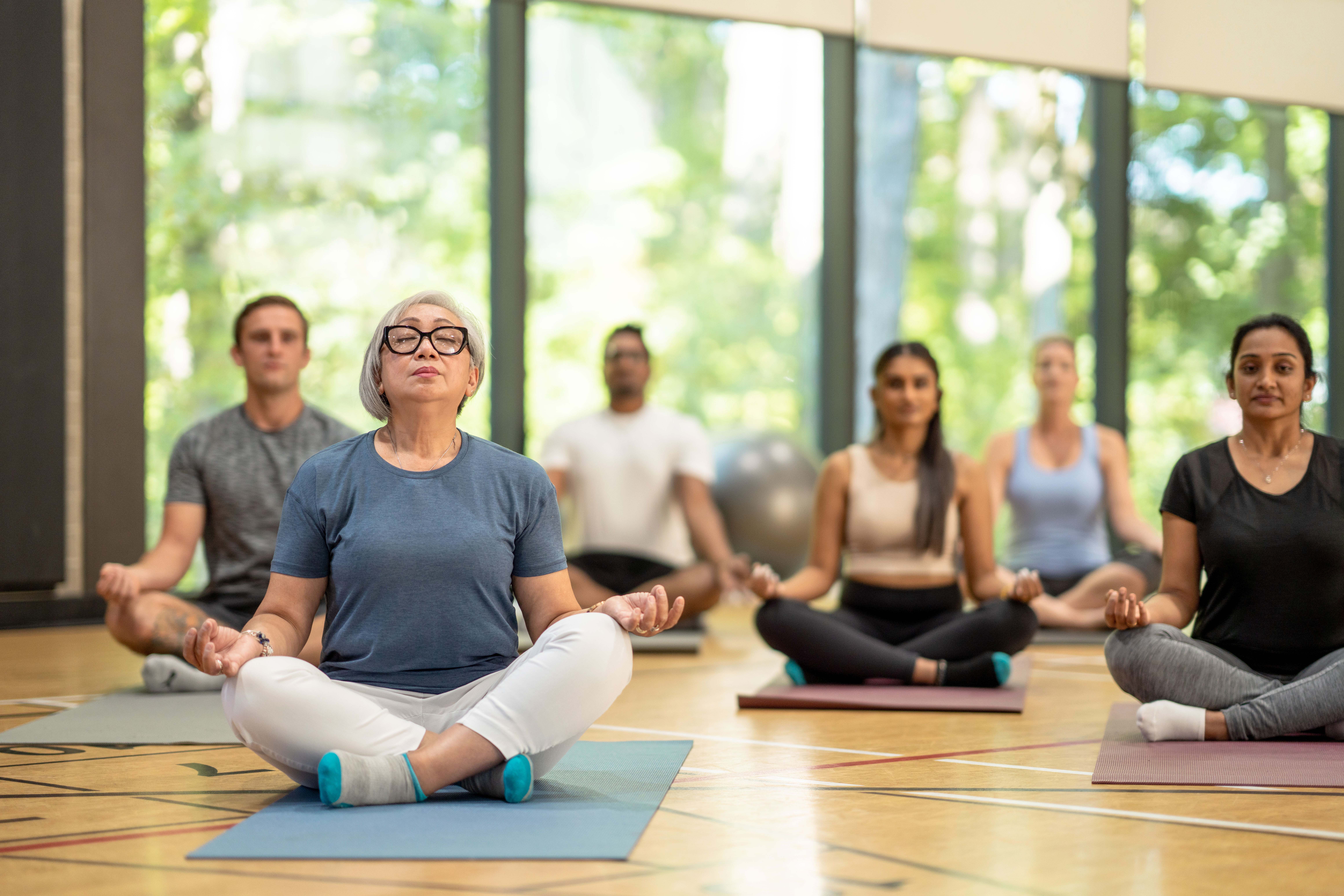 A group of people in a yoga class