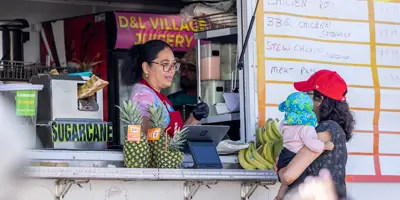 food truck vendor serving customer 
