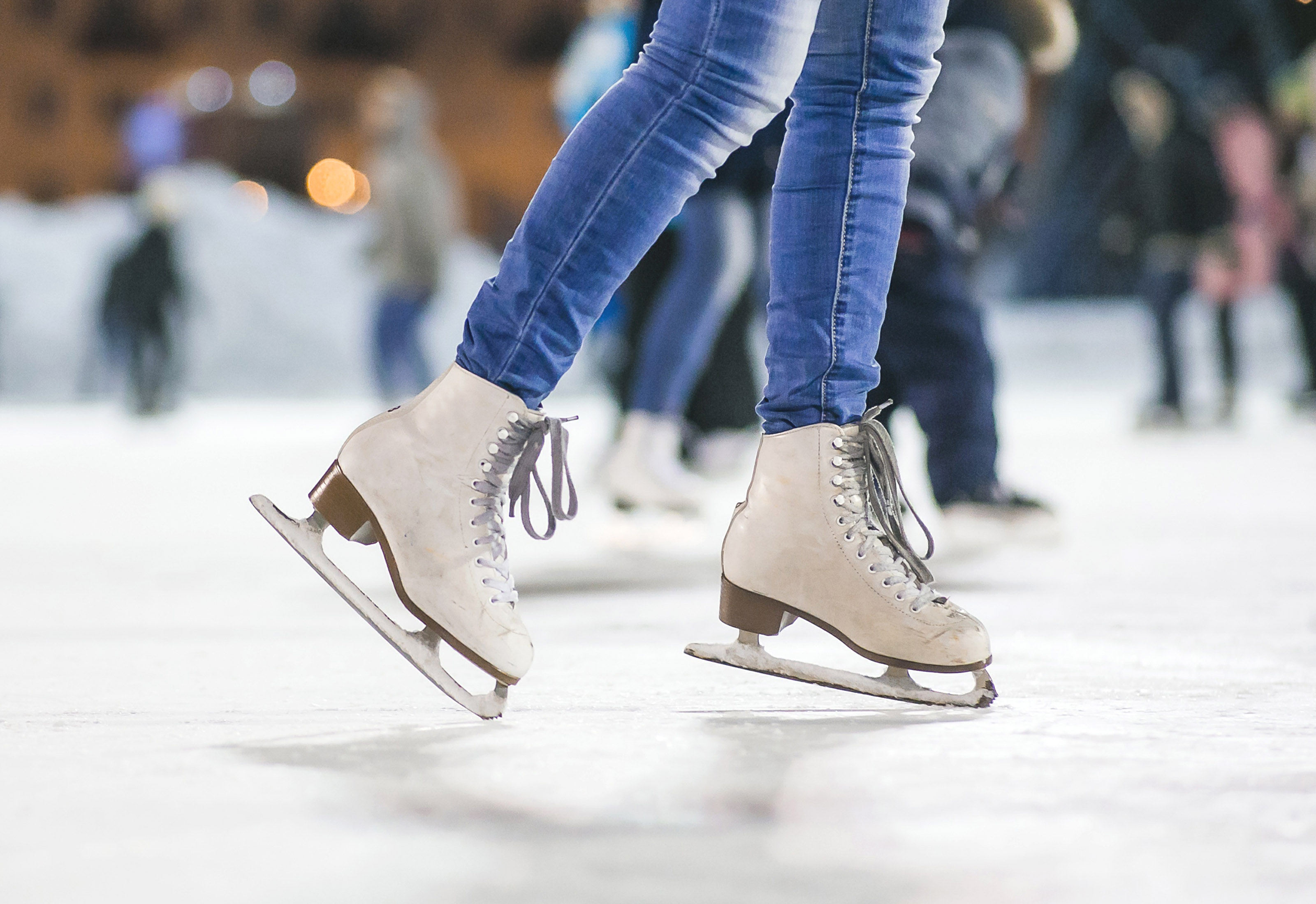 close up of ice skates on ice